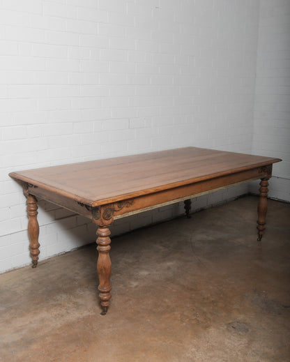 19th Century French Provincial Oak Dining Table with Carved Details and Casters