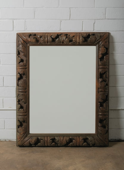 Hand-Carved European Wooden Mirror with Rococo Revival Foliate Detailing