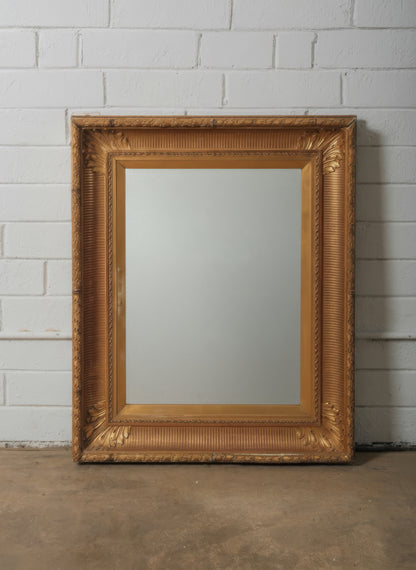 Late 19th Century European Hand-Carved Wooden Mirror with Ornate Foliate Frame