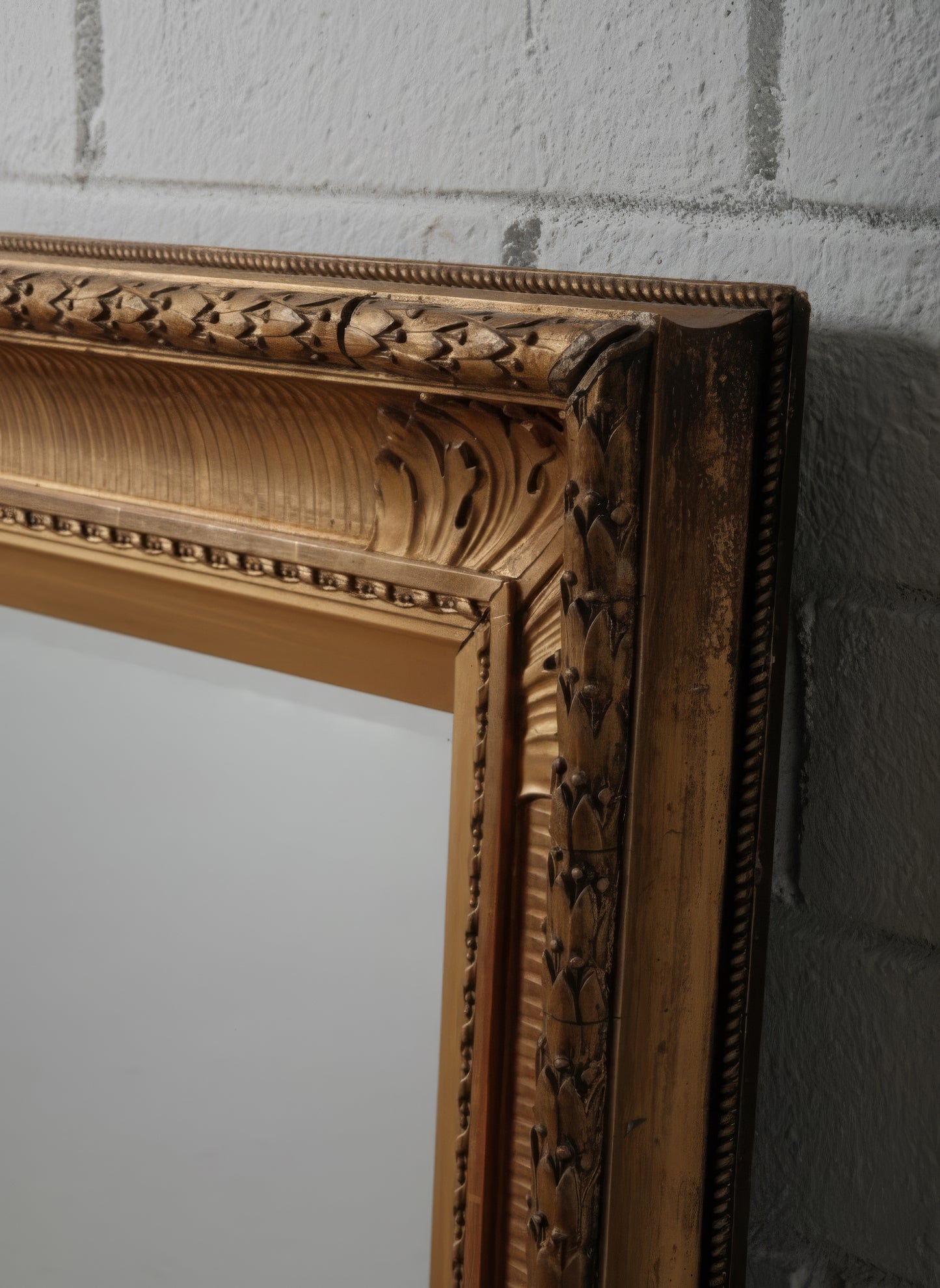Late 19th Century European Hand-Carved Wooden Mirror with Ornate Foliate Frame